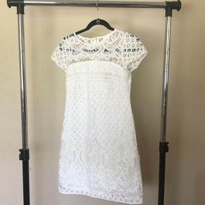Woman’s white lace dress.